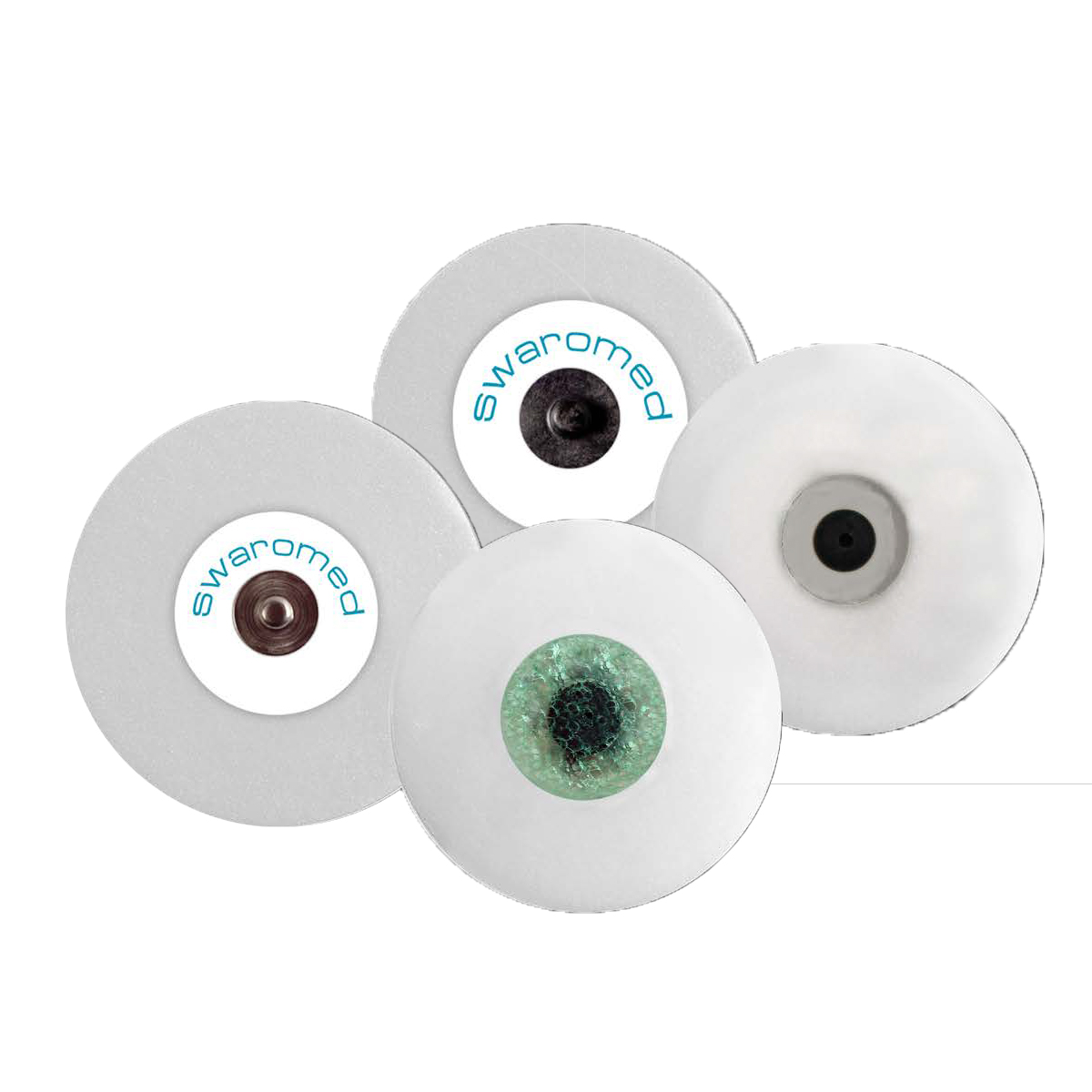 Neljä pyöreää elektrodia, joissa jokaisessa keskellä erilainen kuvio, yksi niistä muistuttaa silmää.