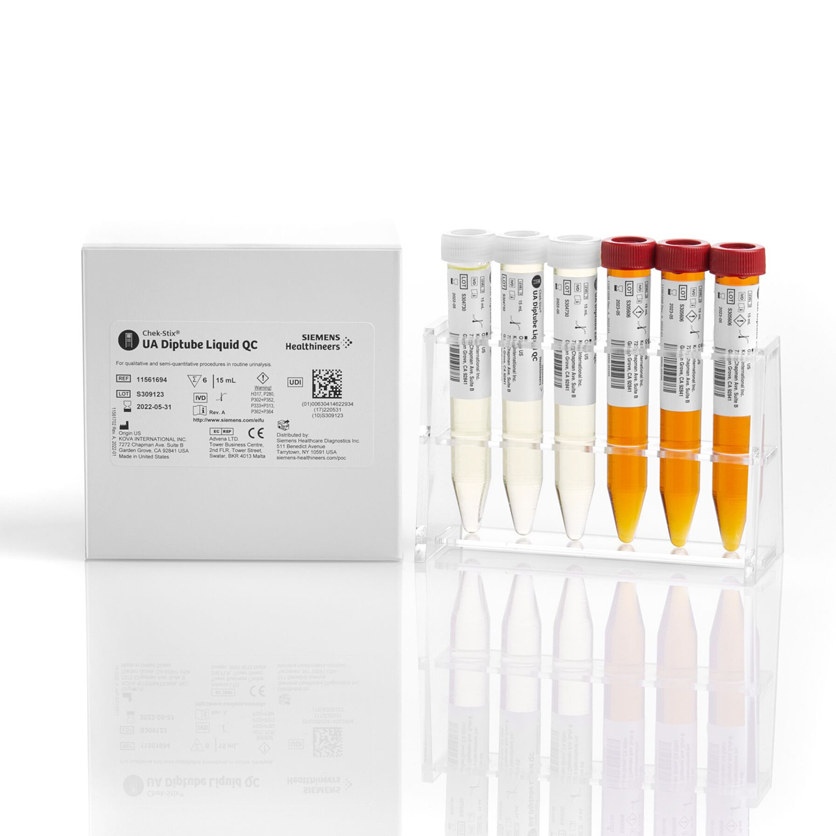 Valkoinen laatikko ja kuusi värillistä putkiloa telineessä laboratoriokäyttöön.